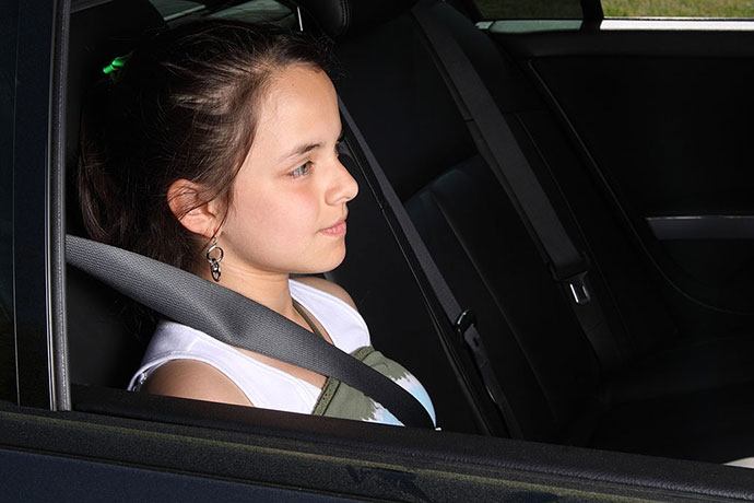 how do we keep tweens safely buckled in the back seat